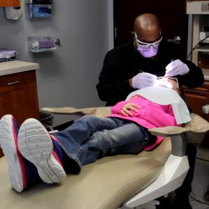 Dentist with pediatric patient